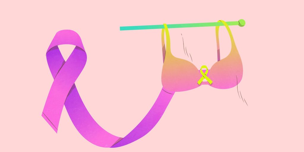 Bannière ruban rose et soutien-gorge sur aiguille à tricoter